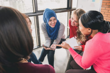 Diverse,Women,Sitting,In,Circle,Enjoying,Sharing,Stories,In,Group Diverse,Women,Sitting,In,Circle,Enjoying,Sharing,Stories,In,Group